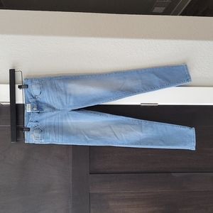 Juniors Revery light wash distressed jeans. Size 14
